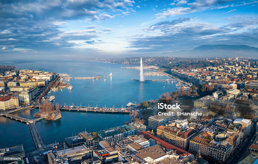 Aerial view over Geneva, the Jet d'Eau and Lake Geneva, with the Alps beyond